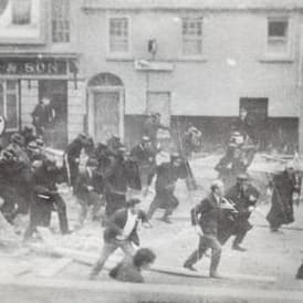 An image of Police clash with rioters in Derry